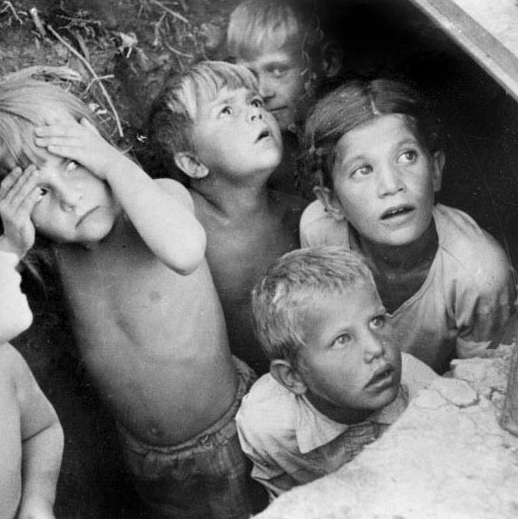 Children sheltering during wartime bombardment